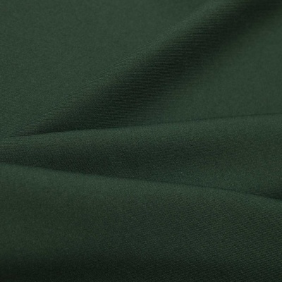 Ткань костюмная 21010 2076, 225 гр/м2, шир.150см, цвет т.зеленый - купить в Курске. Цена 390.73 руб.